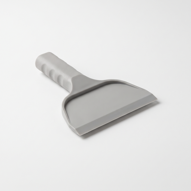 Representative illustration — plastic scraper for label removal; supplied model and packaging may vary.